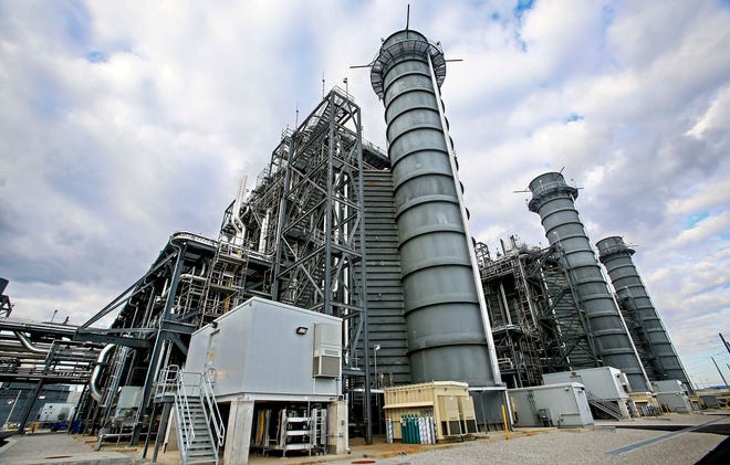 Three 150-foot smokestacks, which emit steam, not smoke, at the FPL Next Generation Clean Energy Center in Riviera Beach.