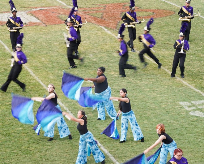Fort Pierce Central marching band and color guard perform during the 41st annual Crown Jewel Marching Band Festival on Saturday, Oct. 8, 2022, at Vero Beach High School. The Crown Jewel is one of the oldest continuous marching festivals in Florida.
