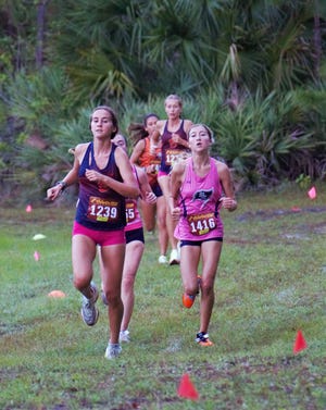 Benjamin's Keira Hodum and St. Edward's Carrington Brown compete at the Region 4-1A Cross Country Championships on Saturday, October 29, 2022 at the Indian River County Fairgrounds in Vero Beach. Hodum took fifth in the race and Brown finished eighth.