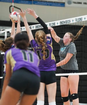 Jensen Beach's Lindsay Walch (44) takes a shot against Okeechobee in the 4-5A Regional volleyball semifinal, Friday, Oct. 28, 2022, at Jensen Beach High School. Jensen Beach won in three sets.