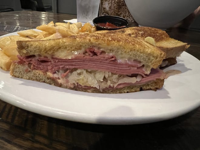 The Grilled Reuben special was a huge pile of lean, thinly sliced seasoned corned beef, Swiss cheese, sauerkraut, and thousand island dressing served on griddled rye with a side of steak fries.