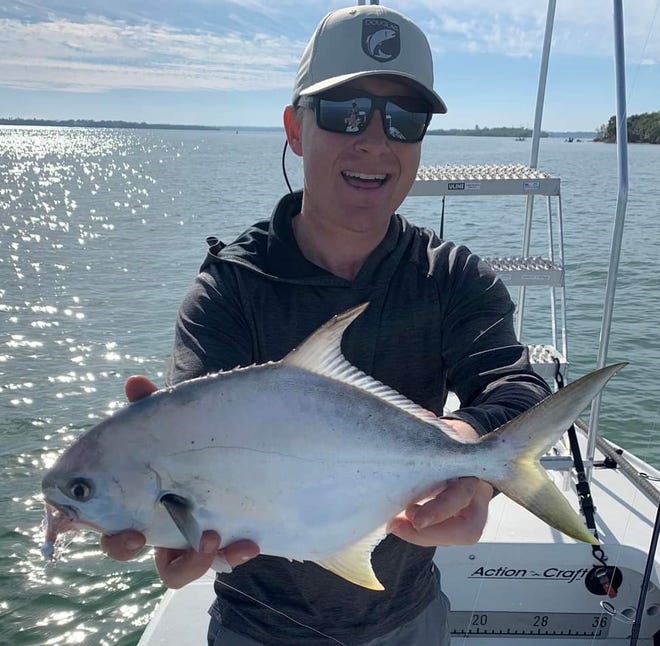 Capt. Giles Murphy of Stuart Angler and a pompano he sight fished on Sailfish Flats during the high tide Jan. 14, 2023.