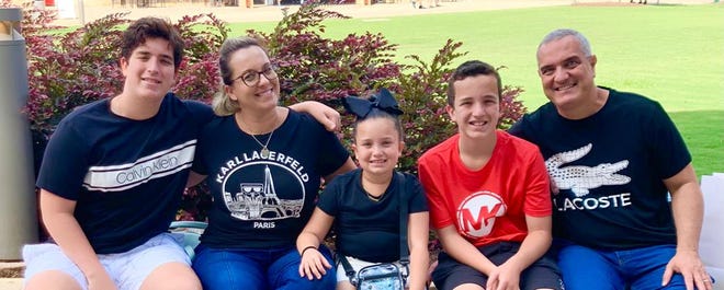 Luiz Rafael Piedade and his wife, Carol, with their three children. The family moved to Florida from Brazil in December 2021.