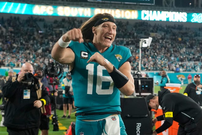 Jacksonville Jaguars quarterback Trevor Lawrence (16) celebrates after defeating the Tennessee Titans in an NFL football game, Saturday, Jan. 7, 2023, in Jacksonville, Fla. The Jaguars won 20-16. (AP Photo/John Raoux)