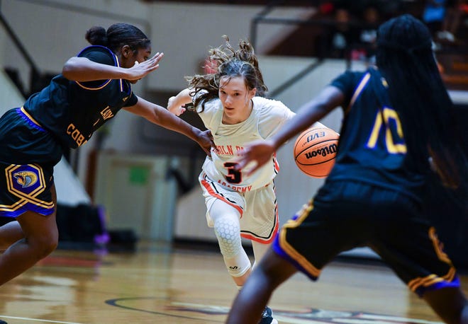 Lincoln Park Academy's Olivia Titherington (3) moves the ball past Fort Pierce Central defenders in the girls Greyhound Holiday Classic basketball final, Tuesday, Dec. 20, 2022, in Fort Pierce. Lincoln Park Academy won 50-36.