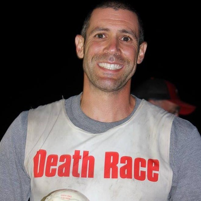 West Boca Raton firefighter and ultra-endurance athlete Joe Falcone, 46, seen in a pinny from a Death Race in 2014.