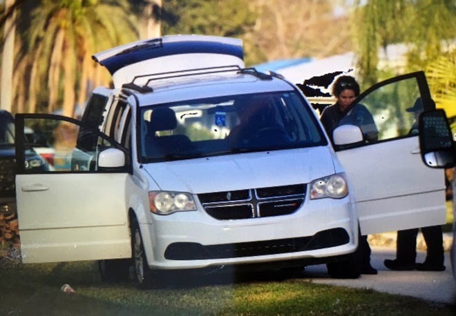 Port St. Lucie crime scene detectives search the van that had been reported stolen with a wheelchair-bound man inside at the intersection of Floresta Drive and South Naranja Avenue on Monday, Jan. 30, 2023, in Port St. Lucie. The van was left there with the man inside, who police said is OK. Police are searching for the man who took the van from a Port St. Lucie convenience store parking lot.