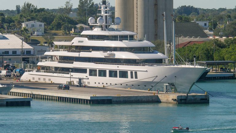 What is a gigayacht and who owns the monster yacht in Port of Fort Pierce?