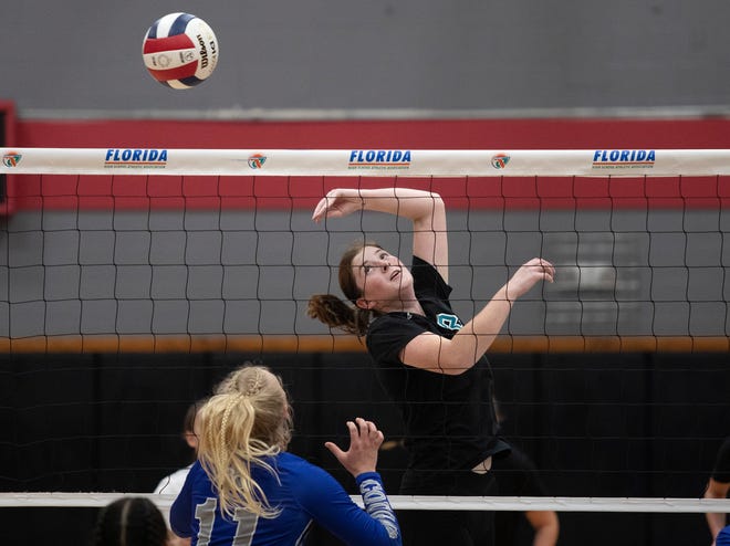 Jensen Beach setter Raegan Richardson tips the ball over the net against Barron Collier in the FHSAA Class 5A volleyball state championship on Saturday, Nov. 12, 2022, at Polk State College in Winter Haven.