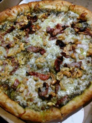 Nino's Jack’s pizza pie has a pesto base, sundried tomatoes and cashews. (Pictured is a medium pizza).