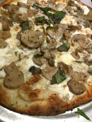Station 49's white truffle Bianchi pizza was a big hit with truffle oil anointing the crust, followed by ricotta cheese and mushrooms.