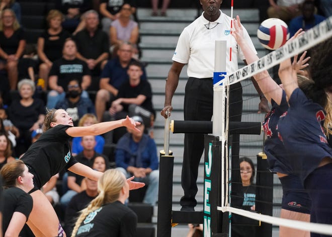 Jensen Beach's Lauren Duke spikes the ball in the 5A state semifinal volleyball match against Vanguard, Saturday, Nov. 5, 2022, at Jensen Beach High School.