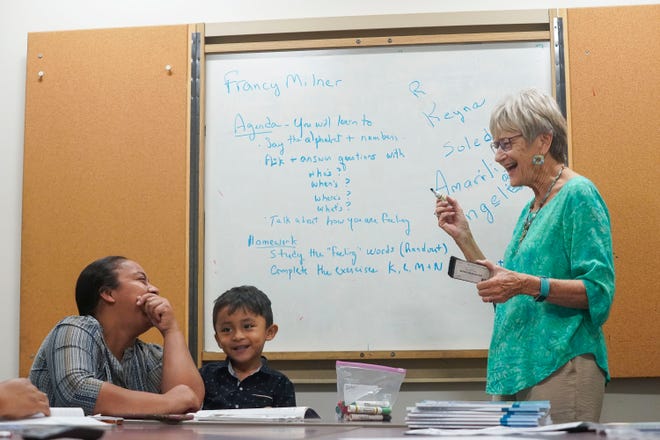 Risyn Herrera (left) spells her name in English to instructor Francy Milner during a beginners English class, Saturday, Jan. 21, 2023, at the Elisabeth Lahti Library in Indiantown.