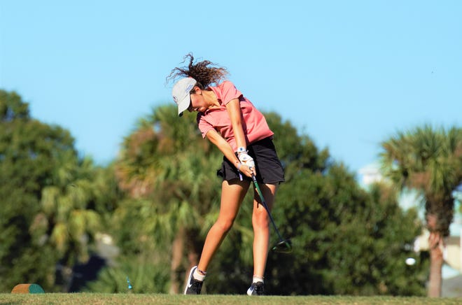 Vero Beach's Dounia Bezzari hits her tee shot on the seventh hole against Jensen Beach and Lincoln Park Academy in a girls golf high school match at Pointe West Country Club in Vero Beach on Thursday, Oct. 6, 2022.
