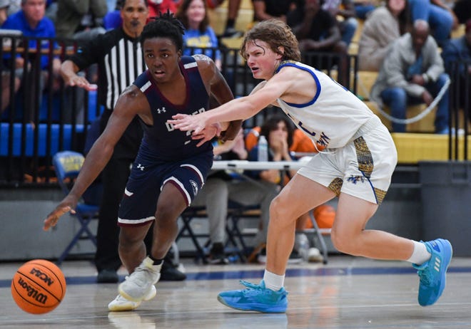 Dwyer's Frenelson Atilus drives to the basket against Martin County during a boys high school basketball game on Wednesday, Jan. 18, 2023, at Martin County High School in Stuart. Dwyer won the game 53-52.