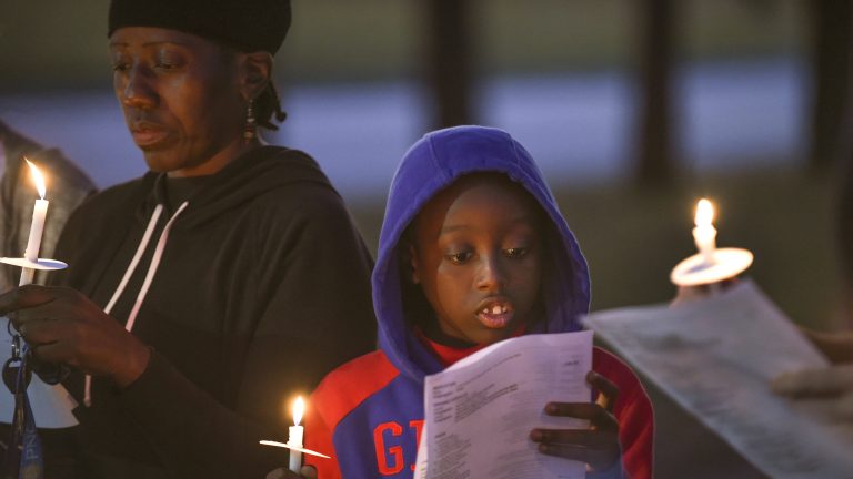 Candlelight vigil for shooting victims ‘a lighthouse’ for a community