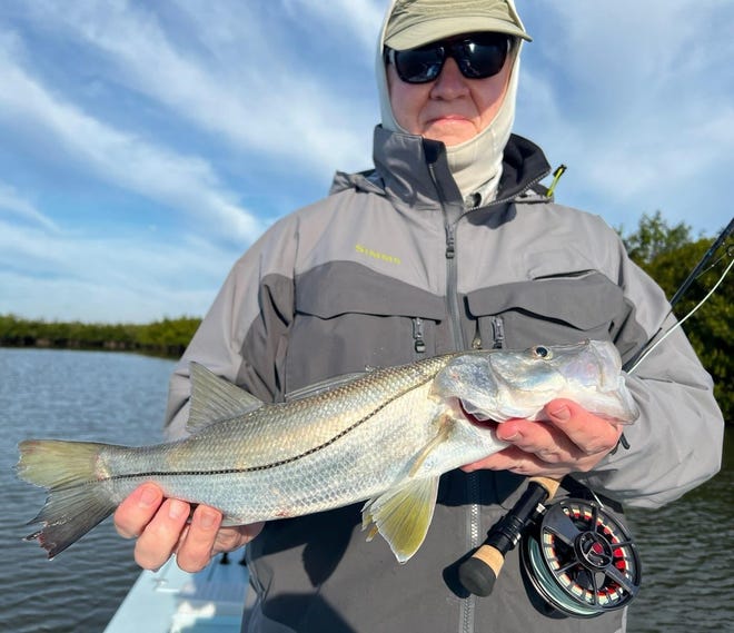 George Rudy, visiting from Pennsylvania, went fly-fishing with Geno Giza in Southeast Volusia and landed this catch-and-release snook.