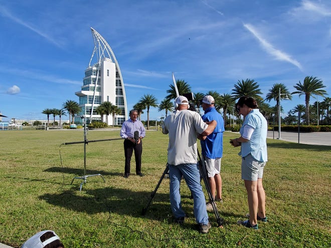 A crew interviews Port Canaveral Chief Executive Officer John Murray in 2021 in front of the port's Exploration Tower during the filming of an episode of the Discovery Channel's road trip series "RV There Yet?"