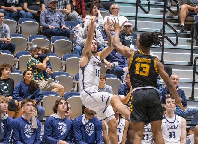 University of North Florida guard Jose Placer follows through on a 3-pointer just before the shot clock that gave the Ospreys a two-point leader over Kennesaw with 27 seconds left in the game on Thursday. He later made the game-winning shot with 1.7 seconds left.