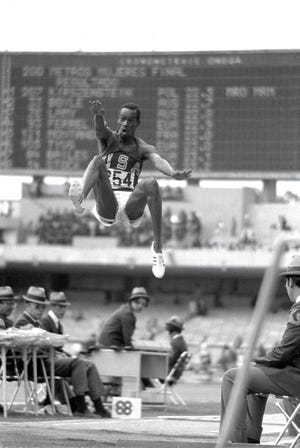 Bob Beamon of the USA breaks the Long Jump World Record during the 1968 Olympic Games in Mexico City. Beamon long jumped 29 feet, 2 1/2 inches, winning the gold medal and setting a new world record.