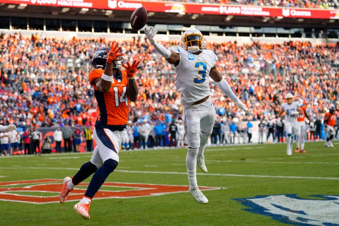 Los Angeles Chargers safety Derwin James Jr. (3) breaks up a pass intended or Denver Broncos wide receiver Courtland Sutton (14) during the first half of an NFL football game in Denver, Sunday, Jan. 8, 2023. (AP Photo/Jack Dempsey)
