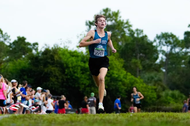 Jensen Beach’s Nicholas Colbert approaches the finish line to take first place in the South Fork Bulldog Classic on Saturday, Sept. 24, 2022 at South Fork High School in Martin County. Colbert won with a time of 16:07.30.