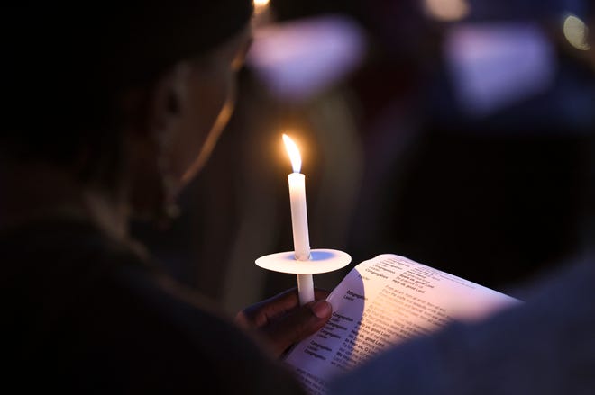 Pastor Richard Cox, of Trinity Lutheran Church, leads a prayer vigil at the corner of North 13th Street and Avenue M on Tuesday, Jan. 17, 2023, for the victims of Monday's mass shooting during a Martin Luther King Jr. Day celebration and car show on Monday at Ilous Ellis Park in Fort Pierce. "We're out here to demonstrate  support that the people involved are members of our community too and that we love them and we're praying for swift healing for those in the hospital and our prayers are with those who lost loved ones yesterday," Pastor Cox said.