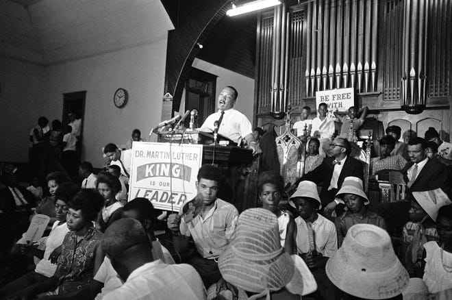 Dr. Martin Luther King speaks at a rally in the sanctuary of St. Paul AME Church in St. Augustine on June 11, 1964.