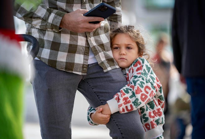 It will be cold enough to wear fleece this weekend across Florida, as Grace Moe, 5, did during a trip to the West Palm Beach GreenMarket on Saturday, Dec. 24, 2022. Forecasters say the 'coldest air since Christmas Day' will hit Florida this weekend.