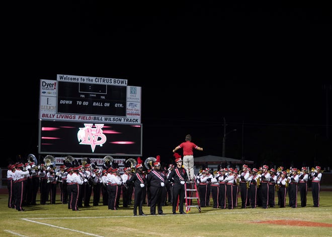 Vero Beach High School marching band and color guard perform during the 41st annual Crown Jewel Marching Band Festival on Saturday, Oct. 8, 2022, at Vero Beach High School. The Crown Jewel is one of the oldest continuous marching festivals in Florida.