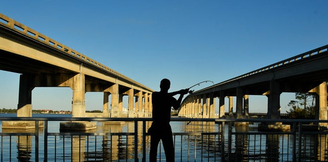 Cocoa resident Simon Jefferson was enjoying the beautiful weather of late afternoon, while fishing under the Hubert H. Humphrey Bridge that connects Cocoa to Merritt Island over the Indian River Lagoon. This bridge along State Road 520 opened on March 1,1968.
(Photo: TIM SHORTT/ FLORIDA TODAY)