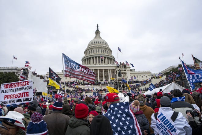 FILE - Rioters loyal to President Donald Trump rally at the U.S. Capitol in Washington on Jan. 6, 2021.  (AP Photo/Jose Luis Magana, File)