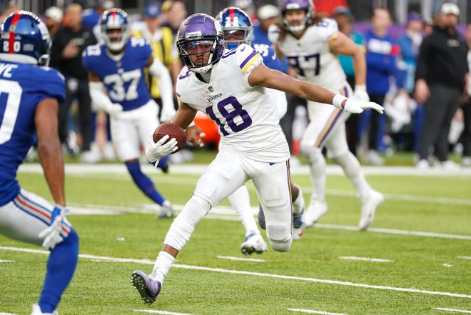 Minnesota Vikings wide receiver Justin Jefferson (18) runs up field after catching a pass during the second half of an NFL football game against the New York Giants, Saturday, Dec. 24, 2022, in Minneapolis. (AP Photo/Bruce Kluckhohn) ORG XMIT: MNCN1