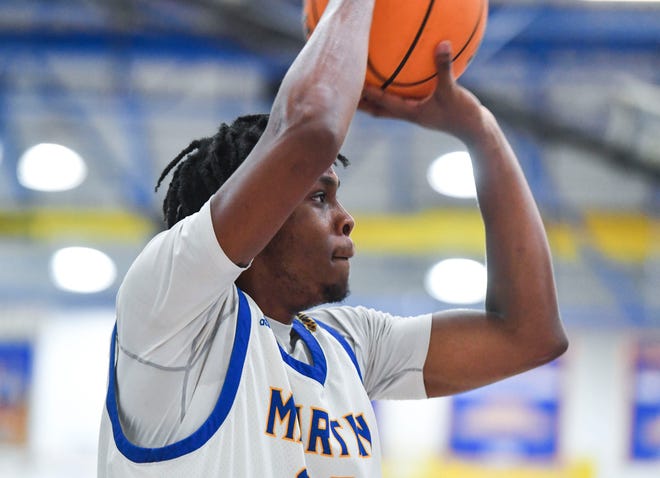 Martin County's Noah Josie (32) goes for a basket against Dwyer in a boys high school basketball game, Wednesday, Jan. 18, 2023, at Martin County High School in Stuart. Dwyer won 53-52.