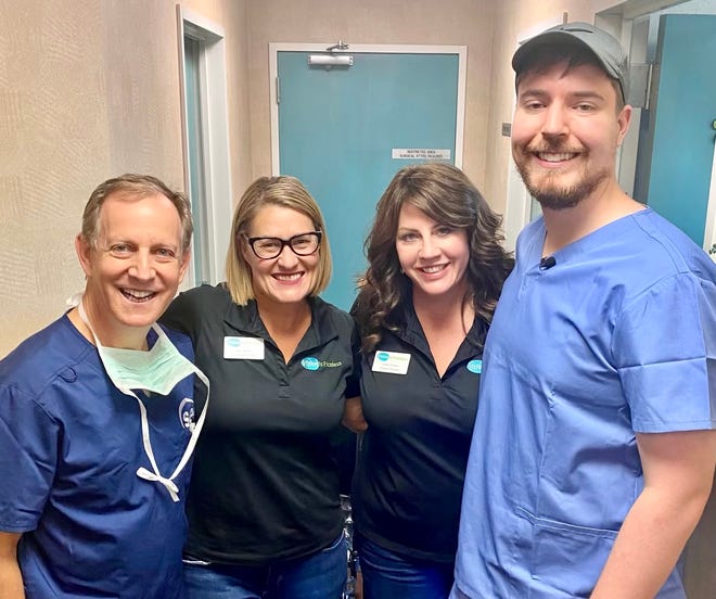 Jimmy Donaldson (right), the YouTuber known as "MrBeast," poses with Dr. Jeffrey Levenson, Jami Gaff Bueker (Vision Is Priceless executive director) and Cheryl Stakes (VIP program manager) when MrBeast came to Jacksonville to film what became his latest viral video ("1,000 Blind People See For The First Time").