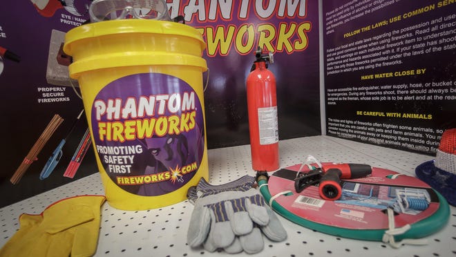 Ira Schwartz, regional manager for Phantom Fireworks, has a display of recommended safety gear for firework use at the Forest Hill Boulevard store in Palm Springs, Fla., on Monday, June 29, 2020.