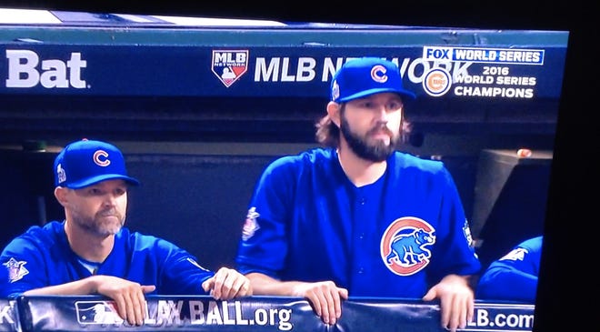Chicago Cubs catcher David Ross, left, watches just before the final out of the 2016 World Series that saw the Cubs win the title.