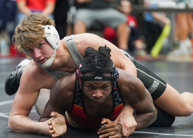 Port St. Lucie's Clayton Yearby (bottom) wrestles Jensen Beach's Nate Sopotnick in the 195 pound match during the Cradle Cancer Invitational wrestling tournament on Saturday, Jan. 7, 2023, at Jensen Beach High School.