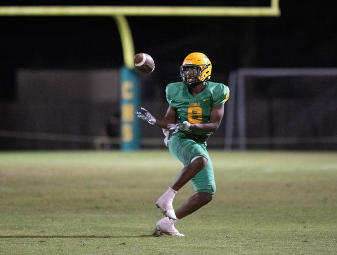 A wide open Demontrae Gaston (8) reels in a long pass and then takes it to the house for a touchdown and a 19-7 Crusaders lead during the Wakulla vs Catholic football game at Pensacola Catholic High School in Pensacola on Friday, Nov. 11, 2022.