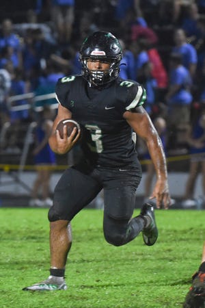 Choctawhatchee running back Cole Tabb carries the ball against Pace on Aug. 26, 2022.