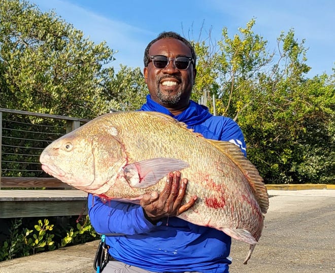 Gerald Hilliard with a black drum that checked in at 37 pounds.