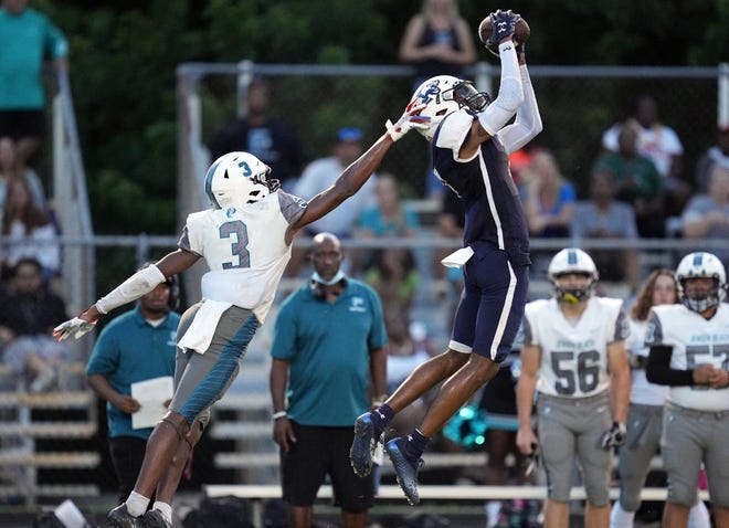 Dwyer’s Kyle McNeal (7) makes catch in front of Jensen Beach’s Jamari Marshall (3) in the first half on Friday, September 1, 2022 in Palm Beach Gardens.