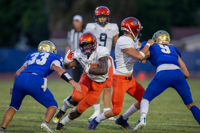 Benjamin running back Chauncey Bowens gaining yards against Cardinal Newman in West Palm Beach, Florida on September 10, 2021.