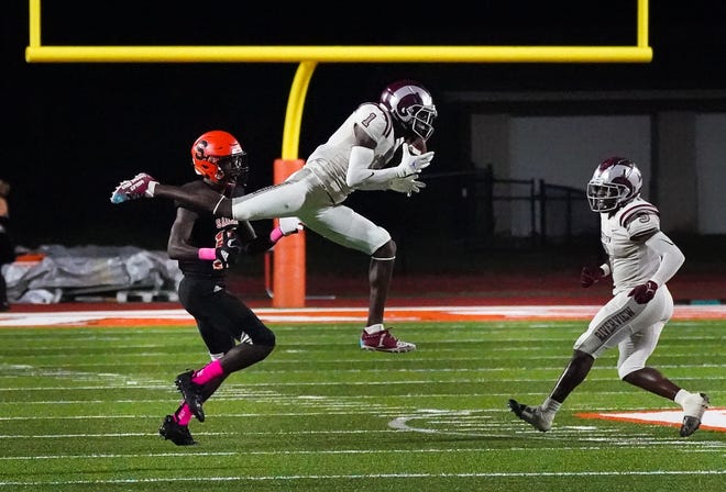 Riverview's Charles Lester III gets the interception during Friday night's game against Sarasota.