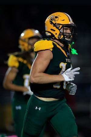 Yulee's Rylan Hale (10) comes off the field after scoring a two point conversion during the third quarter of a regular season football matchup Friday, Oct. 13, 2022 at Yulee High School in Yulee. The Baker County Wildcats edged the Yulee Hornets 31-30.