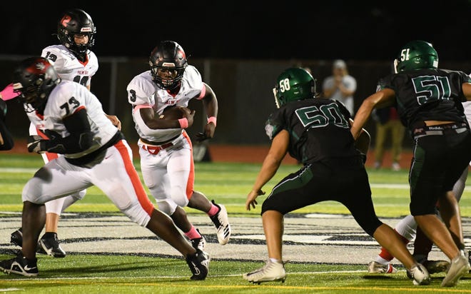 Palm Bay running back Octavion Osby carries the ball against Melbourne on Oct. 7, 2022.