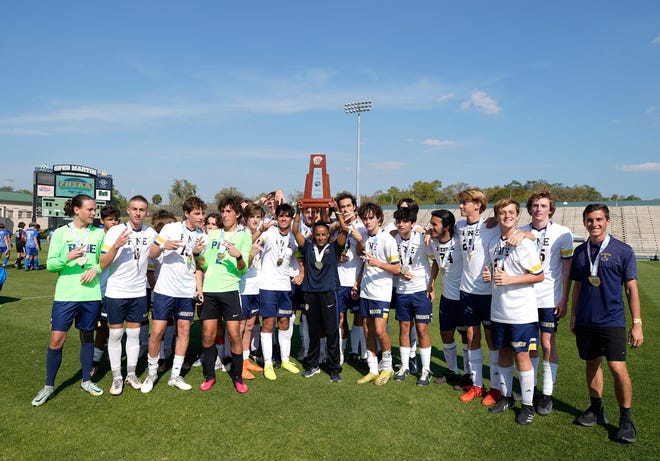 The Pine School celebrate after winning the  the Class 2A Boys Soccer Championship match with The Canterbury School 2-1 at Spec Martin Stadium in DeLand, Thursday, Feb. 23, 2023