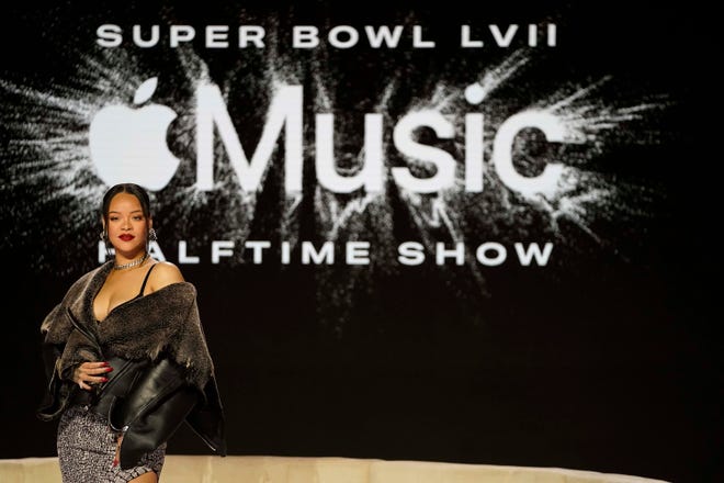 Rihanna poses for a photo after a halftime show news conference ahead of the Super Bowl 57 NFL football game, Thursday, Feb. 9, 2023, in Phoenix. (AP Photo/Mike Stewart)
