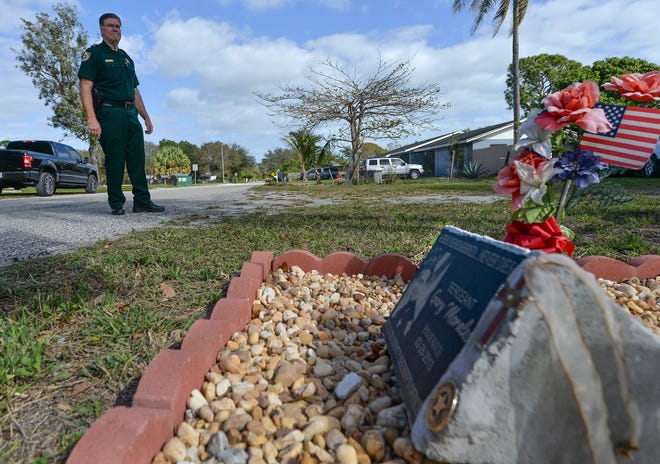 St. Lucie County Sheriff Ken Mascara stands near a memorial for the late Deputy Sgt. Gary Morales, along  the 3200 block of Naylor Terrace on Wednesday, Feb. 8, 2023, in St. Lucie County. Sgt. Morales was shot and killed while trying to get out of his Sheriff's office car during a traffic stop on Thursday, Feb. 28, 2013 on Naylor Terrace.