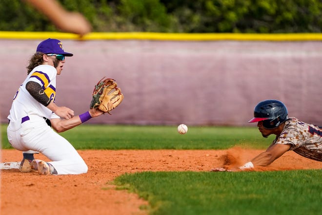 Fort Pierce Central's Isaiah Baez (5) attempts a catch as St. Lucie West Centennial's Jayden Tavaris (12) slides into second base during a high school baseball game Wednesday, March 23, 2022, at Fort Pierce Central High School. Fort Pierce Central won 8-5.